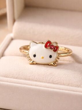 Sanrio Gold Tone Hello Kitty Ring with White Enamel and Red Bow